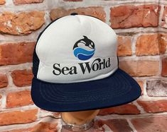 vintage Seaworld mesh truckers hat. This is a good used condition with minor signs of wear NO RETURNS. If I made an error I will take care of it 100% - This is a TRUE VINTAGE item! It is decades/years old. It will have signs of use/wear/age.  All hats ship in a box to retain shape ** Why buy from VINTAGE ASSAULT? Because I have sold THOUSANDS of items to THOUSANDS of satisfied customers and have a track record of quality. Vintage Sea, Sea World, Snapback Hat, True Vintage, Trucker Cap, Snapback Hats, Caps Hats, Trucker Hat, Aura