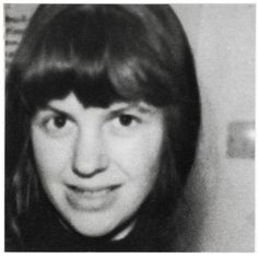 a black and white photo of a woman with long hair