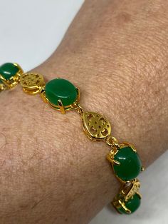 Vintage Green Jade Bracelet Golden white bronze vintage gold finished white bronze Does not tarnish Genuine green jade color enhanced 7.5 inches All jewelry is shipped in a nice gift box. Engraving is $4 per letter and is not always perfect depending on the piece. It can take a few days if the jeweler is busy. This is payable to Paypal Judithsltd@gmail.com Gold Jade Jewelry For Anniversary, Classic Gold Jade Jewelry, Elegant Gold Jade Bracelets, Formal Gold Jade Bracelets, Classic Green Bracelets For Gifts, Green Costume Jewelry Bracelets For Gifts, Green Jade Bracelet, Verde Jade, Jade Color