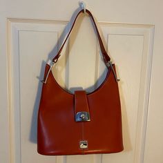 Vintage Dooney & Bourke Shoulder Bag In Red Never Used, And Shows Only Slight Wear On The Duck Logo From Storage Is Still A Nice Firm Leather From Never Being Worn In From A Clean, Smoke Free Environment Red Shoulder Bag With Silver-tone Hardware For Shopping, Red Bags With Silver-tone Hardware For Everyday, Everyday Red Shoulder Bag With Silver-tone Hardware, Red Shoulder Bag With Silver-tone Hardware For Everyday, Red Satchel Shoulder Bag With Palladium Hardware, Red Tote Bag With Palladium Hardware, Red Tote Shoulder Bag With Palladium Hardware, Tan Shoulder Bag With Silver-tone Hardware For Shopping, Red Satchel Bag With Palladium Hardware