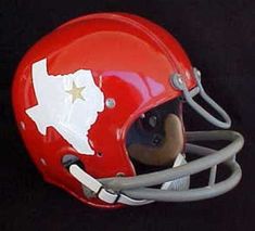 a red football helmet with the state of texas painted on it's face and side