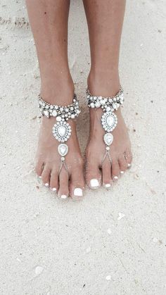 Bohemian Barefoot Sandals For Beach Party, Ankle Strap Barefoot Sandals For Beach Season, Ankle Strap Sandals For Beach Season, Ankle Strap Sandals For Summer Beach, White Flip Flops For Beach Vacation, Adjustable Barefoot Sandals For Summer Beach, Silver Sandals For Summer Beach Occasion, Open Toe Sand Flip Flops For Beach Season, Sand Color Open Toe Flip Flops For Beach Season