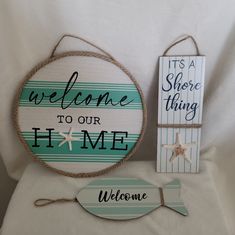 two wooden signs and one sign that says welcome to our home with starfish on it