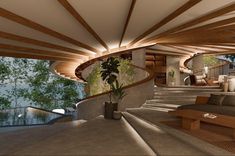 a living room filled with lots of furniture and a staircase leading up to the top floor