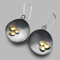 These beautiful earrings are like a cup of courage for your day ahead. Handmade in sterling silver with 18k yellow gold cups and finished in a dark patina. Measures 1 3/4″ long. Arrives to you in a gift box. The Spirit Collection came about in these trying times as a small reminder that during dark times there is light Metal Earrings Handmade, Concrete Jewelry, Dark Times, Metalwork Jewelry, Mixed Metal Earrings, Bronze Jewelry, Earrings Inspiration, Ceramic Jewelry, Metal Earrings