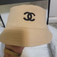 Cotton Chanel Reversible Bucket Hat With Interlocking Cc Embroidered On One Side And Multicolored Print On Other Side From Coco Chanel Collection Most Not Reversible This One Is So Cost Much More So Sad As Bought Meduim To Big On Me So Selling It .Never Worn Just Tryed On Comes With Tags Atached Chanel Recipt Chanel Wrapping Paper Camelia Flower Chanel Ribbon &Chanel Shopping Bag No Box As Box On Pict Belongs To My Chanel Maxi Flap Bag Designer Beige Summer Hat, Designer Beige Hat For Summer, Designer Wide Brim Beige Hats, Designer Beige Flat Brim Hat, Designer Beige Wide Brim Hat, Designer Adjustable Bucket Hat With Curved Brim, Designer Beige Brimmed Hat, Luxury Beige Hat With Embroidered Logo, Designer Beige Adjustable Hat