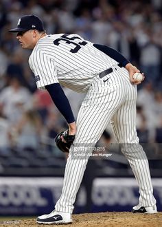 the new york yankees pitcher in action during a baseball game