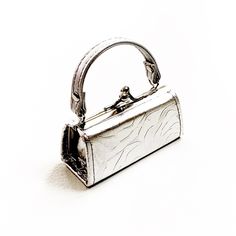 Silver Nano Bag Micro Purse Trend Tiny Purse Approx 4” Long Approx 1 1/2” Wide Nwot Chic Satchel Evening Bag As Gift, Elegant Small Evening Shoulder Bag, Small Elegant Shoulder Bag For Daily Use, Elegant Small Shoulder Bag For Daily Use, Small Elegant Bag With Detachable Strap, Small Elegant Bag For Everyday Use, Elegant Small Bag For Everyday Use, Small Elegant Shoulder Bag For Everyday Use, Silver Box Bag With Detachable Handle For Everyday Use