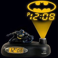 the batman alarm clock is on display in front of a black background with yellow numbers