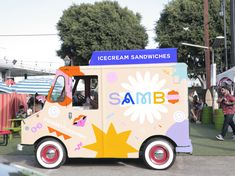 an ice cream truck is parked on the street