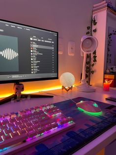 a computer monitor and keyboard on a desk