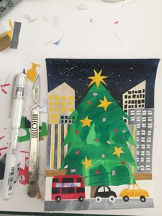 a christmas tree with cars and buildings painted on it