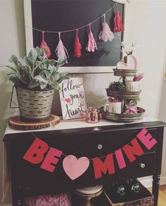 a valentine's day display with pink and red decorations