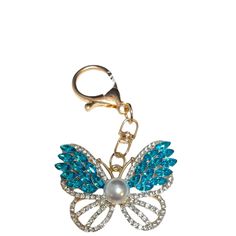 Add a touch of whimsy to your life with our Butterfly Crystal & Pearl Keychain / Bag Charm! This multi-functional accessory adds sparkle and charm to your keys or bag while also serving as a symbol of transformation and growth. Perfect for any butterfly lover! 3" L Pearl Keychain, Diy Purse Organizer, Light Up Bottles, Clear Handbags, Butterfly Crystal, Vegan Tote Bag, Pouch Diy, Wildflower Cases, Drinking Accessories