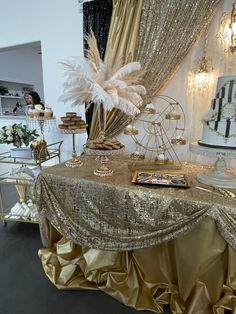 a table covered in gold and white decorations