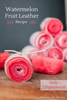 two rolled up pieces of fruit sitting next to each other on a wooden table with text overlay that reads watermelon fruit leather recipe only 2 ingredients