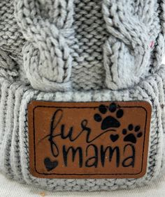 a hat with the word fur mama written on it's side and paw prints