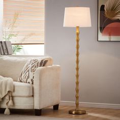 a living room scene with focus on the floor lamp