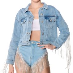 Structured Cotton Washed Denim Fabrication, A Collared Neckline, Button Flap Chest Pockets, A Boxy Cropped Cut, And A Front Button Up Closure. Complete With Rhinestone Link Fringe Along The Back. Casual Denim Jacket With Rhinestone Fringe For Fall, Trendy Denim Jacket With Rhinestone Fringe For Fall, Denim Outerwear With Rhinestone Fringe For Fall, Trendy Spring Denim Jacket With Rhinestone Fringe, Fitted Denim Jacket With Fringe For Spring, Casual Long Sleeve Outerwear With Rhinestone Fringe, Casual Denim Jacket With Rhinestone Fringe, Fall Denim Outerwear With Rhinestone Fringe, Casual Long Sleeve Denim Jacket With Rhinestone Fringe