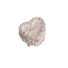 a pink and white heart shaped basket on a white background