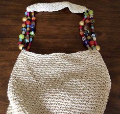 Beautiful Cappelli large beaded shoulder bag.  This bag reminds on summer and beach. This bag is beautiful made with colorful beads and shoulder straps. It looks new, it doesn't show any ware. It has one zipped compartment and 2 smaller compartments. The measurements are: the height is 14 inches, the width is 14 inches. The strap is 15 inches. I have a few other Cappelli Purses in my Store https://globalvintagenesting.etsy.com/listing/1567788430 https://globalvintagenesting.etsy.com/listing/1586137485 https://globalvintagenesting.etsy.com/listing/1686355968 Beaded Shoulder Bag, Bag Summer, Beaded Bag, Bag Shoulder, Beach Bag, Purses And Handbags, Shoulder Straps, Straw Bag, Straw