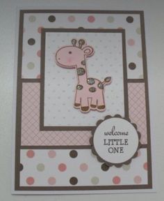 a card with a giraffe and polka dot design on the front, it says welcome little one