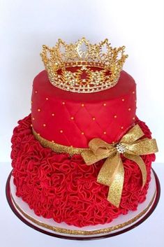 a red and gold cake with a crown on top