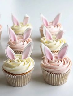 several cupcakes with bunny ears on them