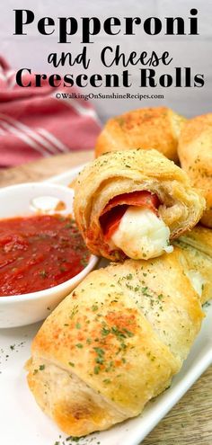 pepperoni and cheese crescent rolls on a plate with dipping sauce