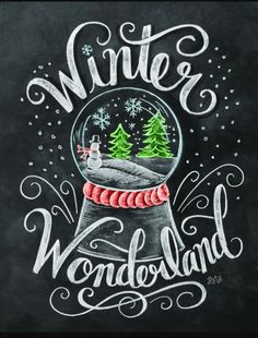 a chalkboard with the words winter wonderland written on it and trees in a snow globe