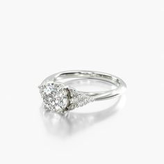 a white gold ring with two diamonds on the top and bottom, set in 18k white gold