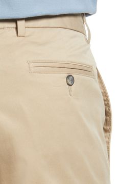 Crisp and classic, these flat-front khakis made of cotton twill sport a touch of stretch that moves across your entire casual wardrobe. 16" leg opening; 10 3/4" front rise 97% cotton, 3% spandex Machine wash, tumble dry Imported Cotton Chinos With 5-inch Inseam And Pockets, Casual Chino Cotton Twill Work Pants With Belt Loops, Tapered Leg Chinos With Belt Loops In Cotton Twill, Fitted Cotton Cargo Pants For Business Casual, Beige Chino Cotton Twill Bottoms With Belt Loops, Chino Cotton Twill Chinos With Belt Loops, Chino Cotton Twill Trousers With Belt Loops, Business Casual Chino Cotton Twill Work Pants, Business Casual Chino Twill Work Pants With Belt Loops