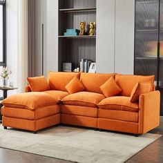 an orange sectional sofa in a living room