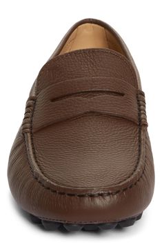 Inspired by 1950s driving shoes, this leather style is handmade with moc-toe stitching and a trademark pebbled sole that provides excellent traction. Leather upper and lining/leather and rubber sole Made in Italy Designer Shoes Classic Brown Moccasins With Textured Sole, Moc Toe Driving Loafers With Leather Sole, Brown Calf Leather Plain Toe Moccasins, Brown Calf Leather Moccasins With Plain Toe, Brown Plain Toe Calf Leather Moccasins, Classic Moc Toe Driving Loafers, Classic Moc Toe Loafers For Driving, Brown Leather Lining Moc Toe Loafers, Brown Leather Moc Toe Loafers