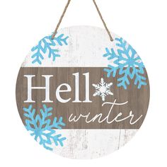 a wooden sign that says hell winter with snowflakes hanging from the side of it