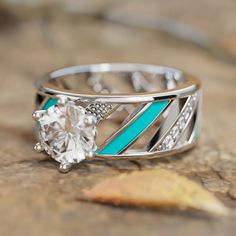 Material: 925 Sterling Silver Color: Silver Craftsmanship: Turquoise Enamel Gemstone: Moissanite Mainstone size: 7.5*7.5mm *It is recommended to wipe the ring regularly to maintain its luster, avoid contact with chemicals, and store it properly to avoid scratches or damage. Promise Ring In Turquoise Sterling Silver, Turquoise Enamel Ring For Anniversary, Turquoise Enamel Anniversary Ring, Turquoise Crystal Promise Ring, Turquoise Birthstone Ring With Accent Stones, Turquoise Prong Setting Promise Ring, Turquoise Promise Ring With Prong Setting, Turquoise Round Diamond Ring, White Turquoise Ring For Anniversary