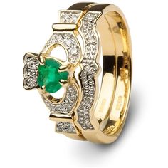 an emerald and diamond ring set with two matching bands on each side, in yellow gold