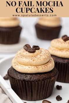 two chocolate cupcakes on a plate with coffee beans around them and text overlay that reads no fail mocha cupcakes