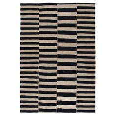 a black and white rug with stripes on it