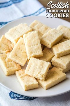 a white plate topped with crackers on top of a blue and white table cloth