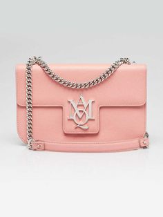 Alexander McQueen Pink Grained Leather Insignia Shoulder Bag Description Alexander McQueen's 'Insignia' bag is made from textured-leather with the new polished silvertone metal logo plaque on the flat front. A chain shoulder strap completes this effortlessly chic look. Just big enough to hold your essentials while still maintaining a feminine touch. Condition The exterior leather is clean and beautiful throughout with some creasing to the body of the bag and shoulder pad. The hardware is bright and crisp with minimal hairline surface scratches. The interior is clean with light rubbing. Details Overall Condition: Like new Exterior Condition: Like new Interior Condition: Like new Includes: None Material: Pink leather Handles: Single chainlink shoulder strap Closure/Opening: Flap top with mag Alexander Mcqueens, Metal Logo, Leather Handles, Metallic Logo, Pink Leather, Leather Handle, Shoulder Pads, Chain Link, Alexander Mcqueen