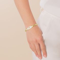 The Love Links Medical ID Bracelet in Mother of Pearl and Gold is an eye-catching update to a customer favorite. Made from durable, hypoallergenic, gold tone stainless steel, this 24/7-wear style features a mother of pearl inlay and gold tone medical symbol. Your personal information is located on the inside of the ID tag, keeping your engraving private and secure.

This women�s medical ID bracelet is a great choice for those with memory loss, hearing loss, epilepsy, food or drug allergies, hear Medical Id Bracelets, Pearl Love, Medical Symbols, Mother Of Pearl Inlay, Pearl Inlay, Hearing Loss, Id Bracelets, Engraved Items, Custom Engraving