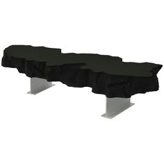 a bench made out of black rock with white legs