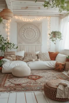 a living room filled with lots of furniture and plants on the wall, along with string lights