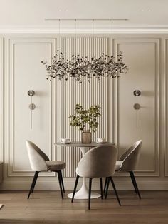 an elegant dining room with white walls and wooden floors