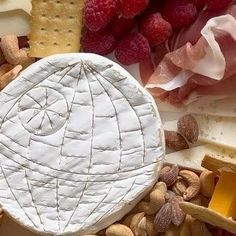 cheese and crackers are arranged on a table