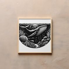 a black and white drawing of a whale swimming in the ocean on a beige wall