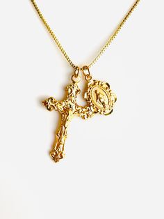 "This is a beautiful gold or silver double charm necklace featuring a 16k gold over 925 sterling silver Italian style crucifix cross pendant alongside a 16k gold over a small 925 sterling silver Mother Mary miraculous medallion.  Both pendants come together on a 1mm 14k gold-filled box chain. This is an incredible piece of heirloom jewelry for women!  These gorgeous charms are made by master silversmiths here in the USA.  Such attention to detail these charms are so exquisite that the photos do not do them justice!  Cross is shiny measures 28x17mm.  Miraculous measures 12x8mm with Mother Mary seal on backside. This necklace comes in a 16\", 18\", 20\" length. Comes in a gift box ready to present. Model has a small necklace, is wearing the 16\" length. This necklace is also available 925 st Madam Secretary Jewelry, Gold Plated Crucifix Necklace Tarnish Resistant, Gold Plated Tarnish Resistant Crucifix Necklace, Gold-plated Tarnish-resistant Crucifix Necklace, Crucifix Cross Necklace With Figaro Chain As Gift, Figaro Chain Cross Necklace As Gift, Yellow Gold Charm Necklaces With Cross Pendant, Gold Cross Charm Necklaces, Yellow Gold Crucifix With Miraculous Medal