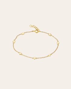 Beautifully handcrafted 14k yellow gold hearts charm bracelet, with approx. 7 small hearts, on a dainty cable link adjustable bracelet chain 6''- 7". A perfect everyday layer bracelet! Chain Length: 6"-7" Total Weight: Approx. 2 grams Ships in 4-7 business day Rush orders ship in 2-4 business days Comes gift ready in a custom Zoe Lev jewelry box. *Eligible for return, per our policy. See here for details. Charm Anklet, Custom Jewelry Box, Gold Hearts, Bracelet Chain, Layered Bracelets, Small Heart, Heart Bracelet, Heart Charm Bracelet, Adjustable Bracelet