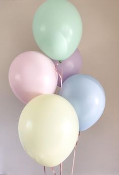 a bunch of balloons that are in the air